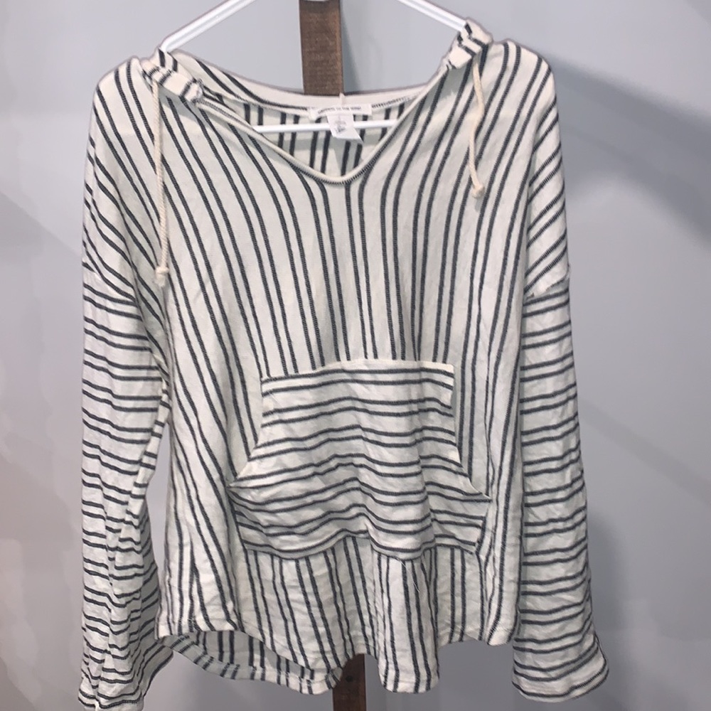 this is a white long sleeve oversized shirt with black striped.